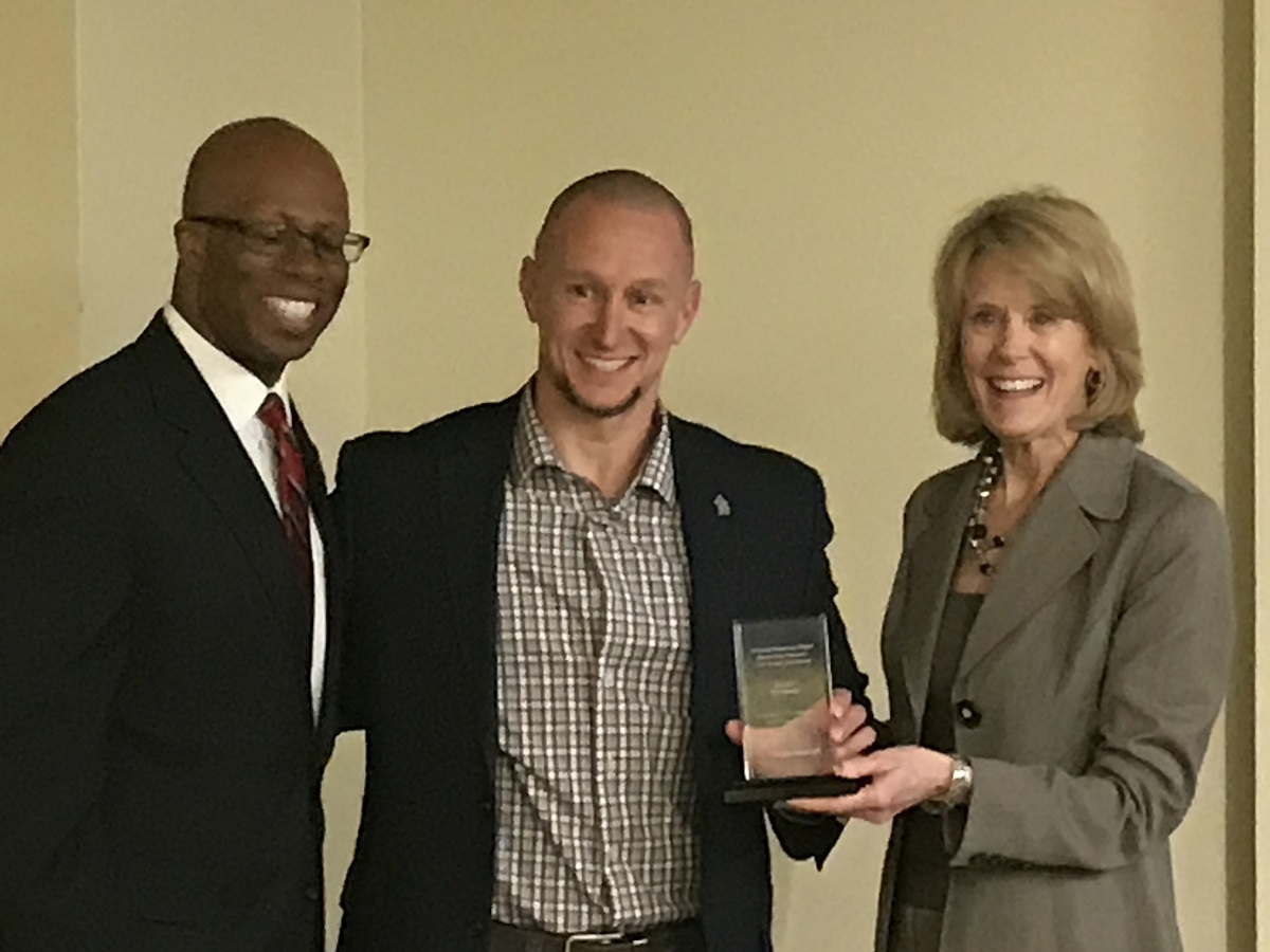 Erik Rankin (center) with Vice President for Student Affairs Levester Johnson and Interim Vice President for Academic Affairs and Provost Jan Murphy