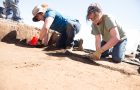 Illinois State anthropology students Brian Keeling and Molly McManus dig through the thick soil at the Noble-Wieting site.