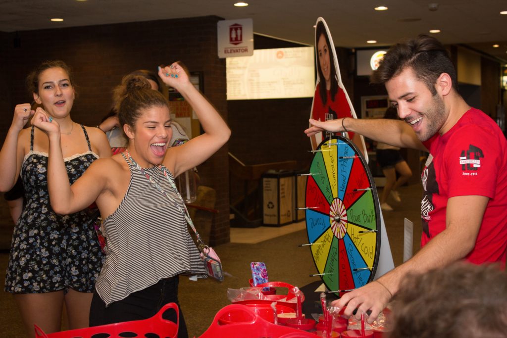 Students playing with a prize wheel