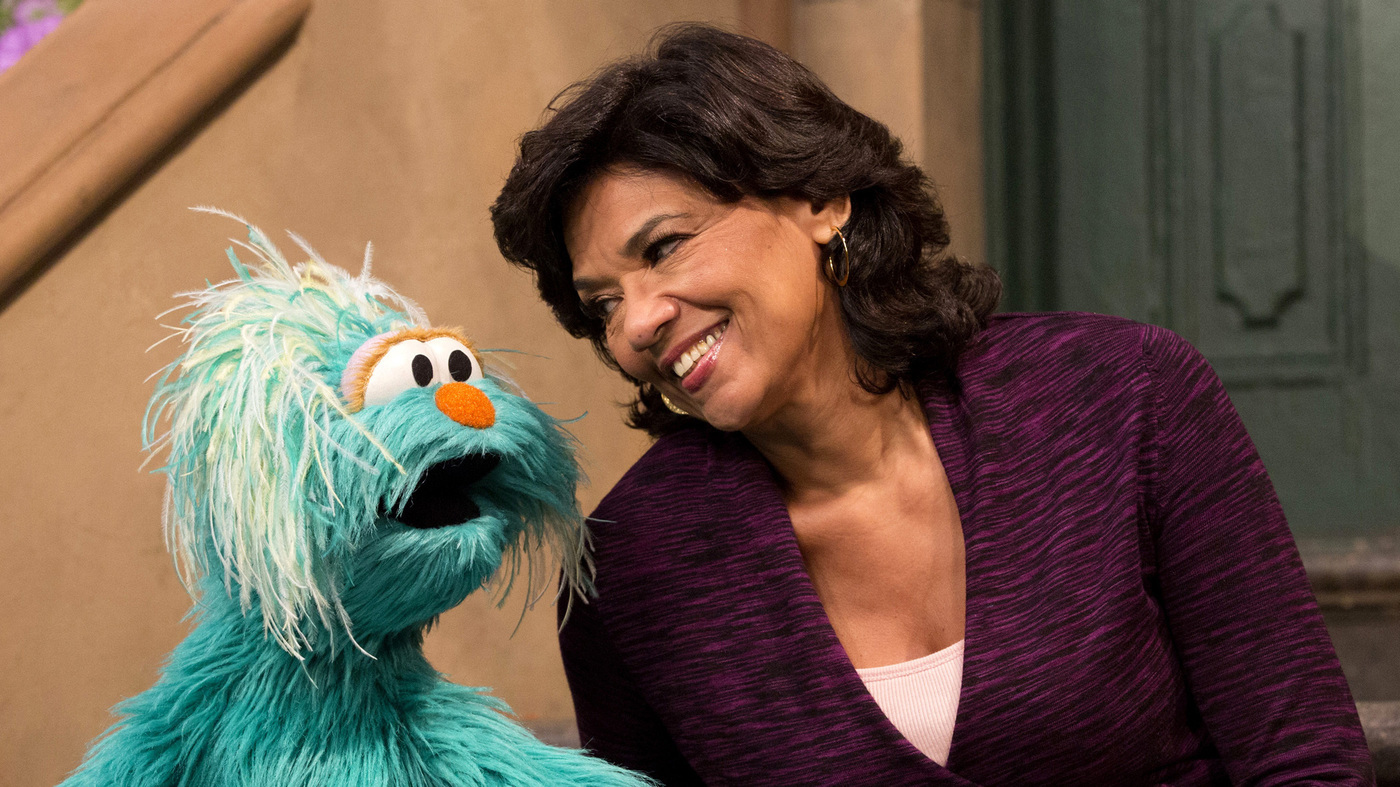 Sonia Manzano speaks with a Muppet.