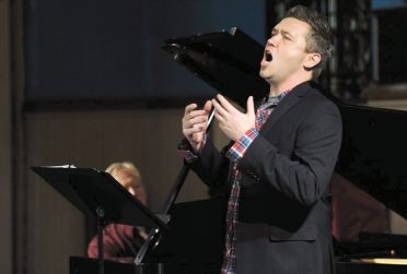 Justin Vickers singing in concert