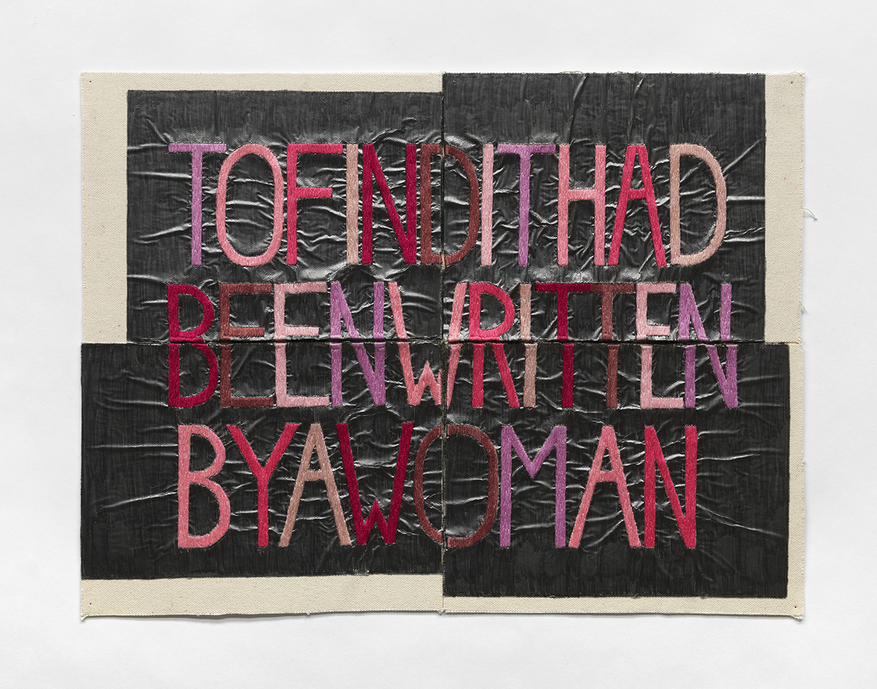 Pink embroidered letters spelling "to find it had been written by a women." The background is canvas and solid graphite.