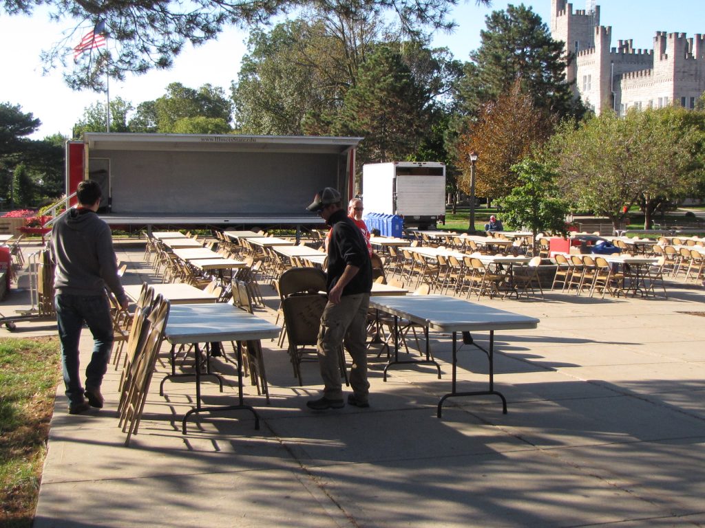ISU Movers setting up tables and chairs for Homecoming