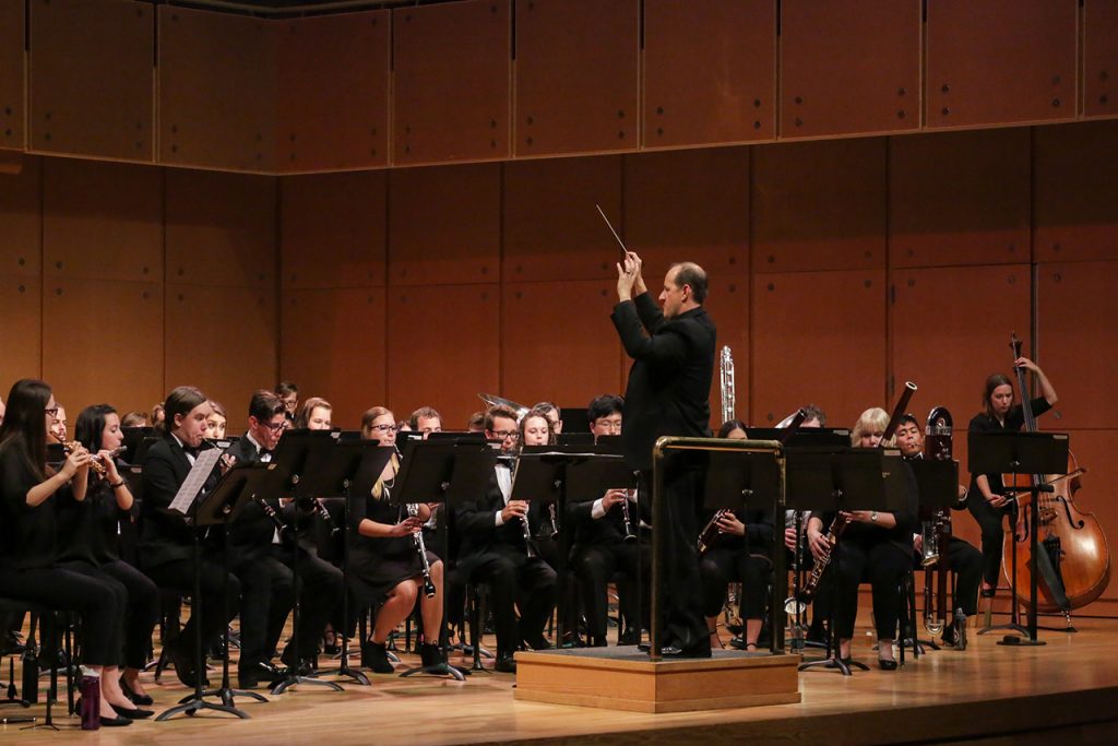 Photo of Anthony Marinello conducting the ISU Wind Ensemble on September 22, 2017