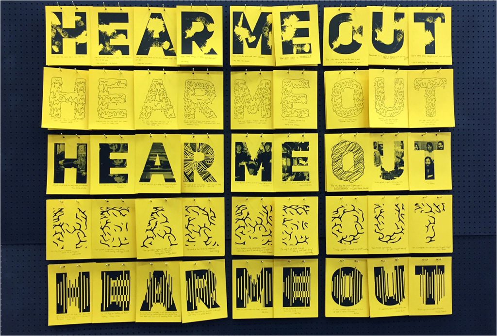 The phrase Hear Me Out repeated in different font styles as part of an exhibit at Milner Library.
