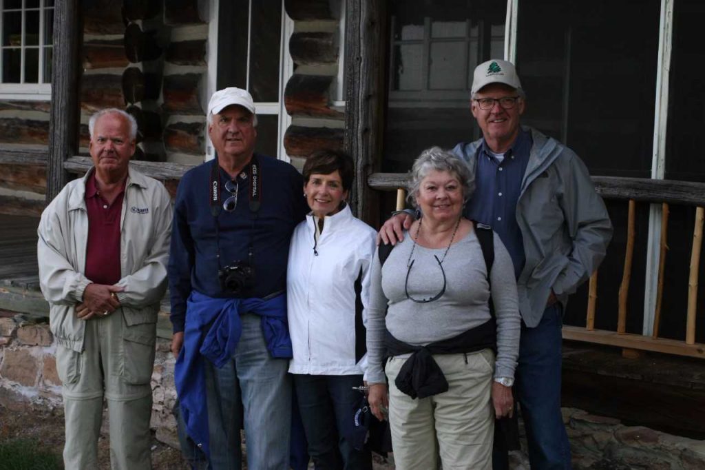 The Klauer family stands in front of the Mather-Klauer Lodge in Grand Island.