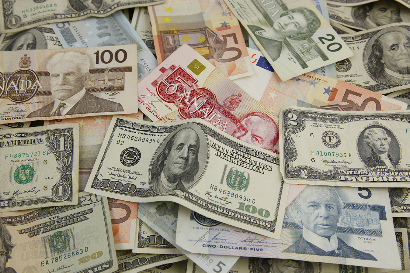 image of international currency, money from countries all over the globe