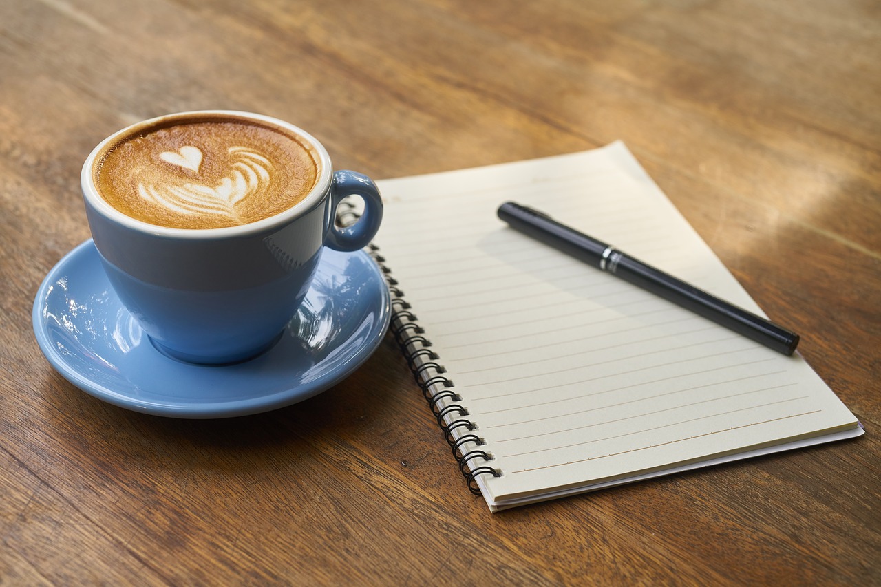 coffee with notebook and pen