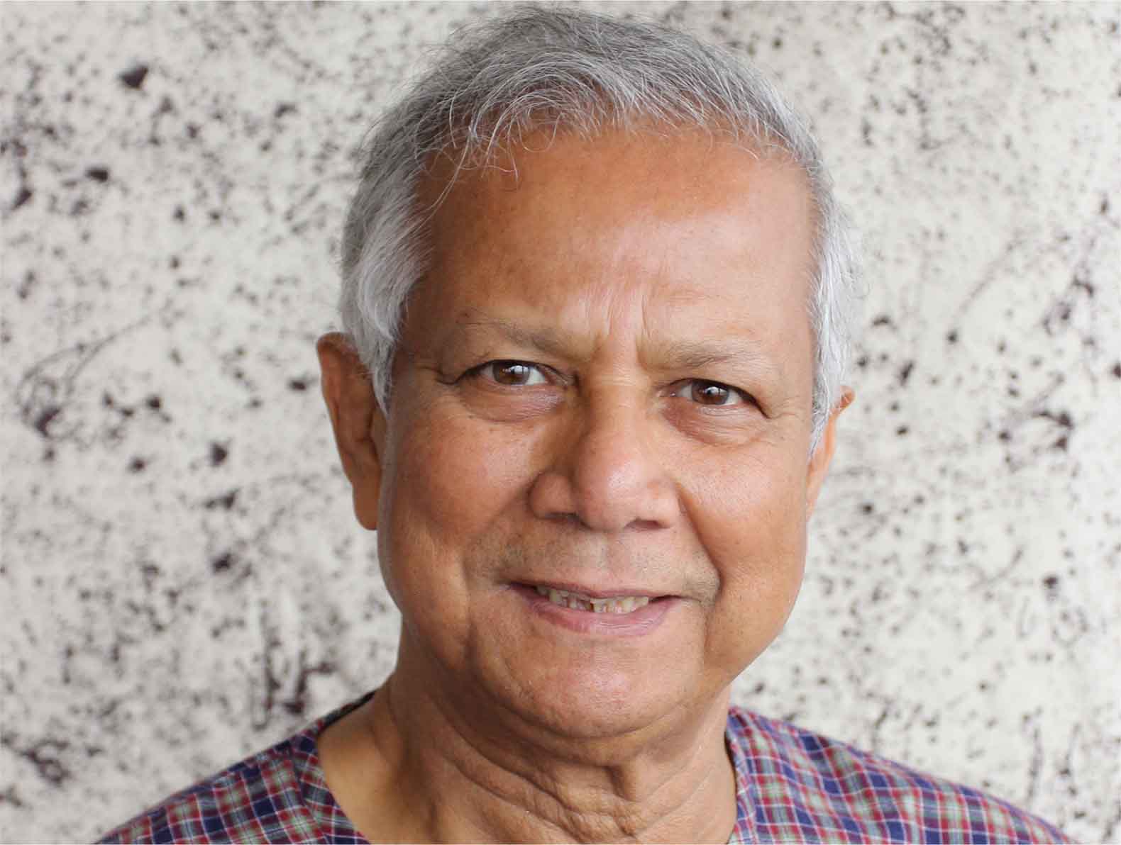 professor Muhammad Yunus smiling for the camera