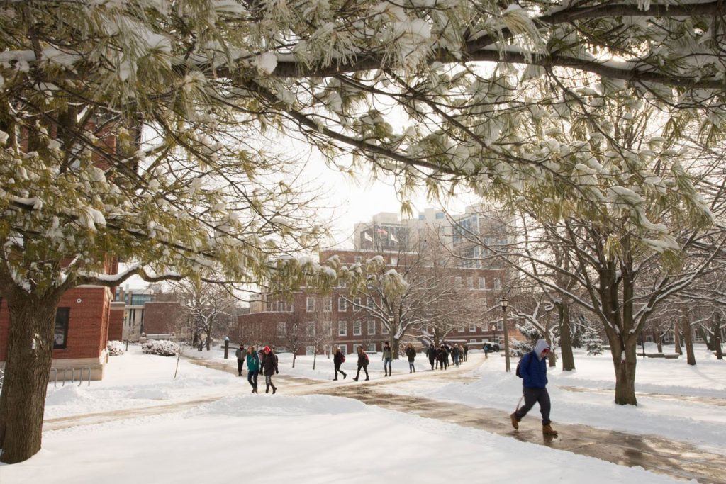 Students walking on snowy Quad