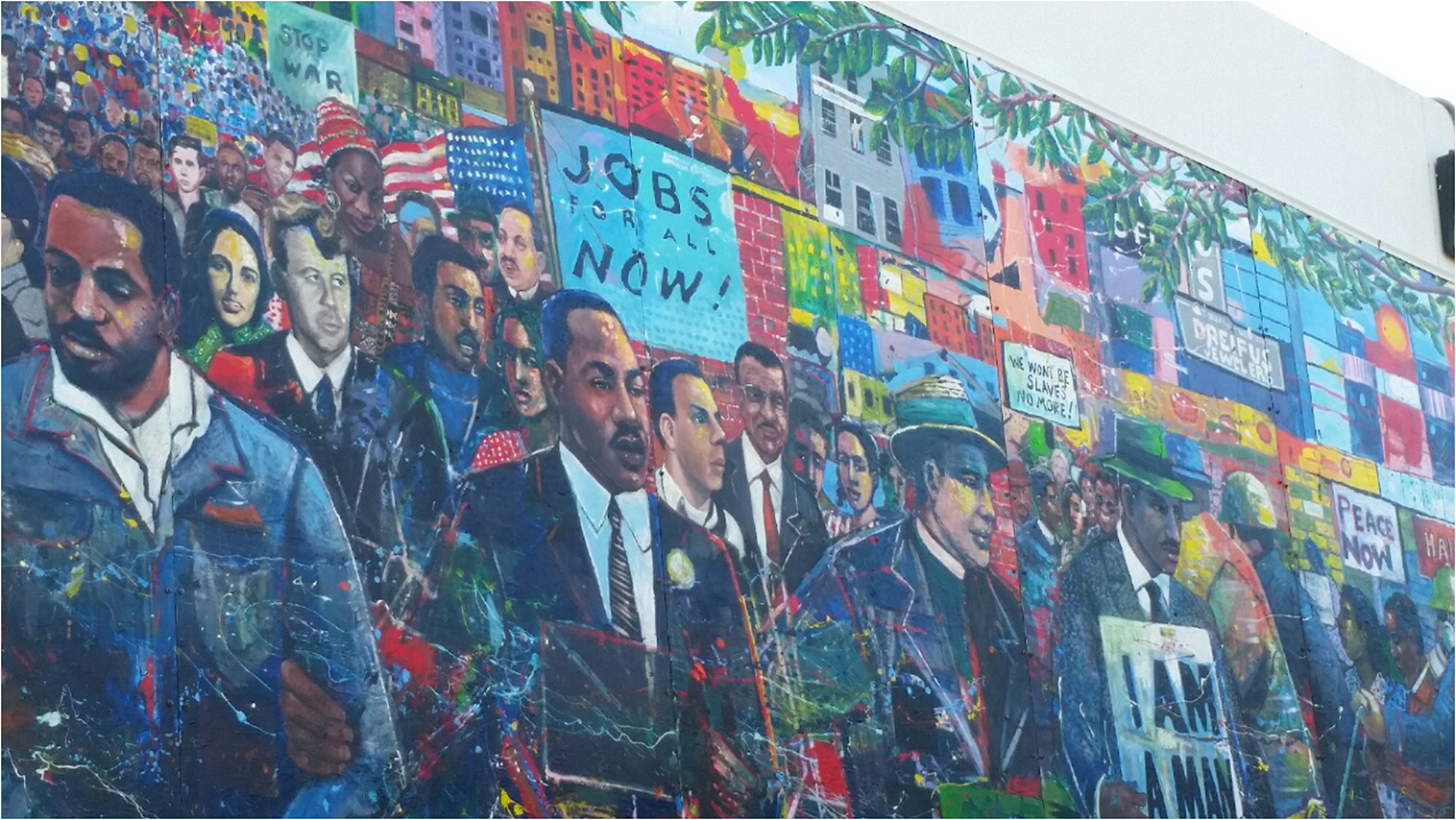 image of a mural filled with civil rights leaders and social justice advocates