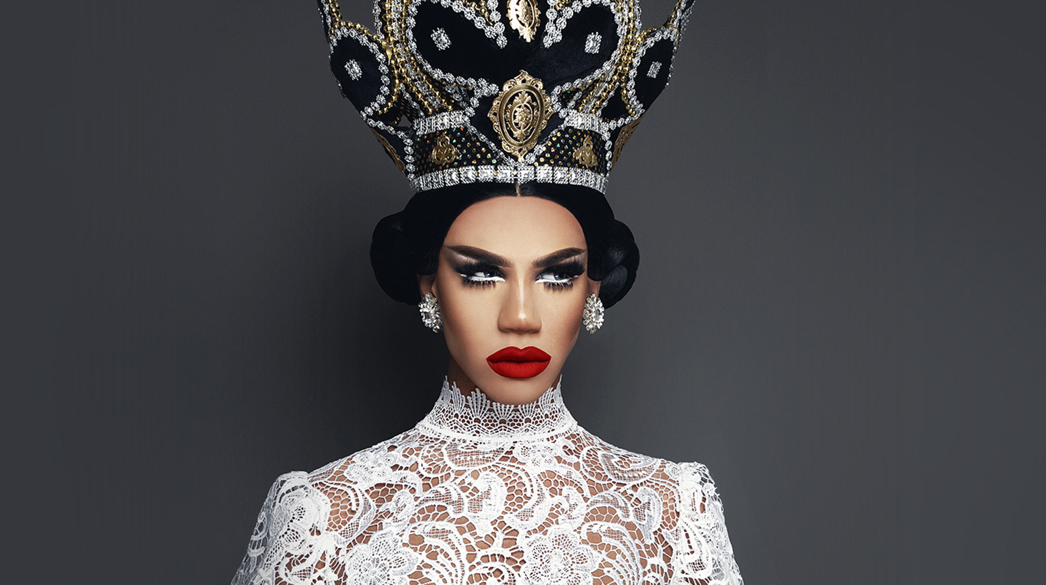 Naomi Smalls wearing top of intricate lace and a bejeweled crown