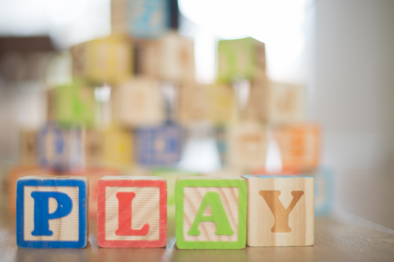 Play-based Instruction with children's blocks forming the word play