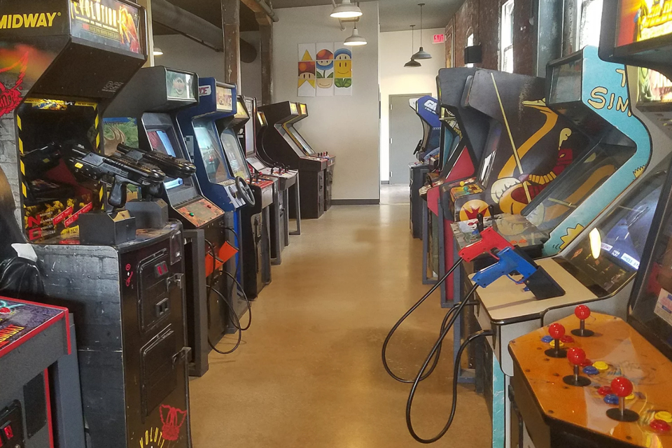 two rows of arcade game machines