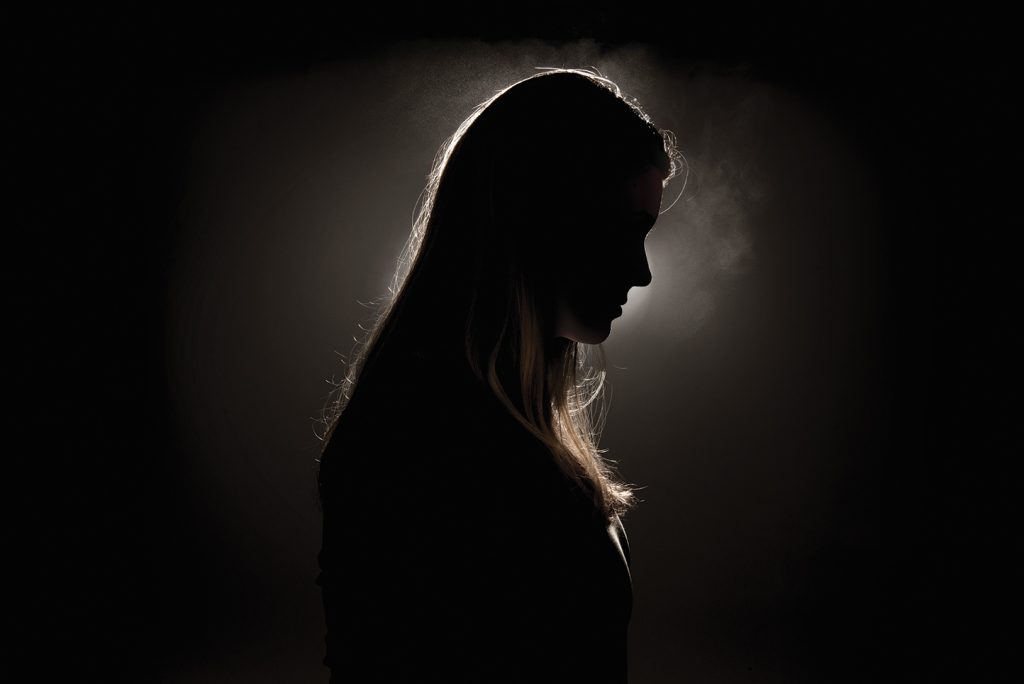 Woman pictured in shadows