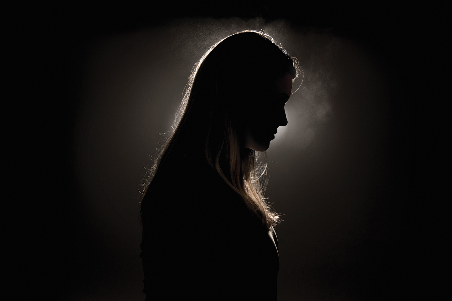 Woman pictured in shadows