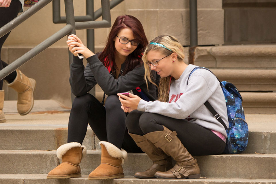 Students use their cell phones to access Linkedin