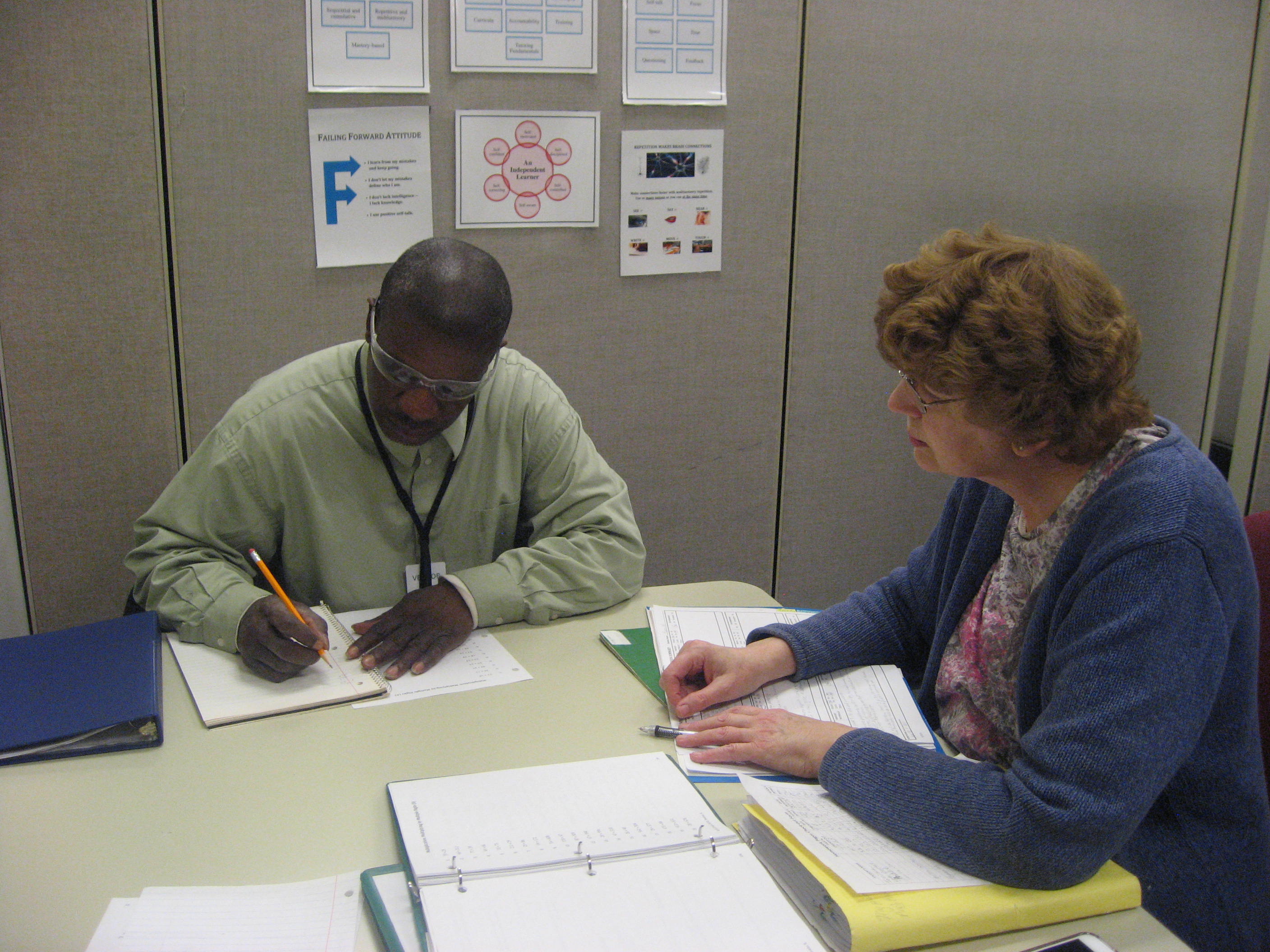 Regan and Cindy, project READ participants, work through a one-on-one math lesson.