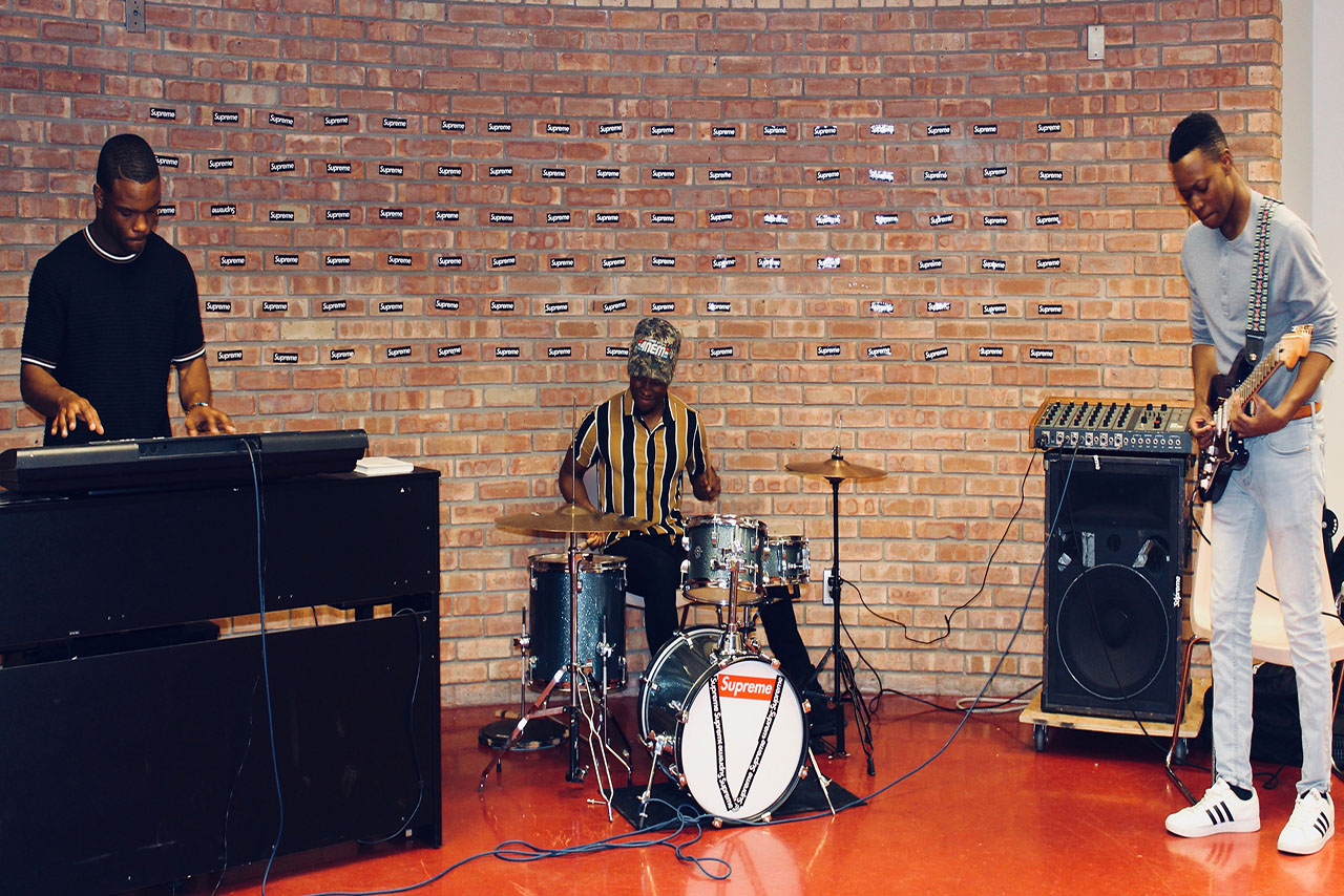 VisionMade, a band formed by Justin Pickett, Antonio Crossley and Tobi Taiwo (left to right) practice the keyboard, drums and guitar in the basement of Hewett hall.
