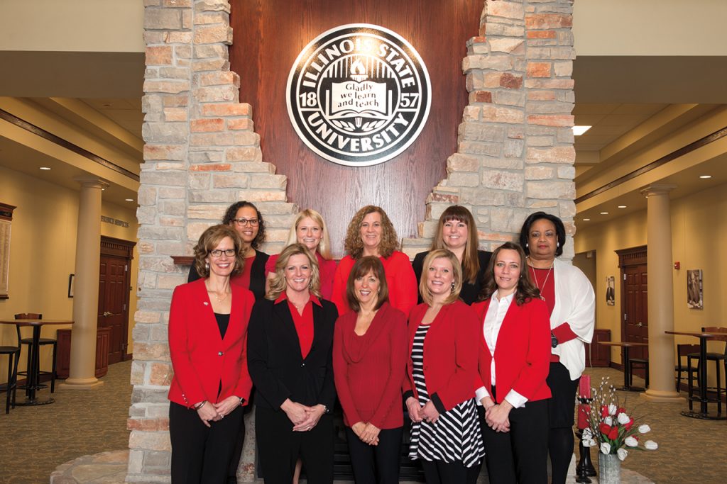Kristin “Kris” (Meseth) Harding (front row, far left) began as executive director of the University’s Office of Alumni Engagement in the spring following the retirement of Doris (Liefer) Groves ’81. Harding leads a staff of nine.