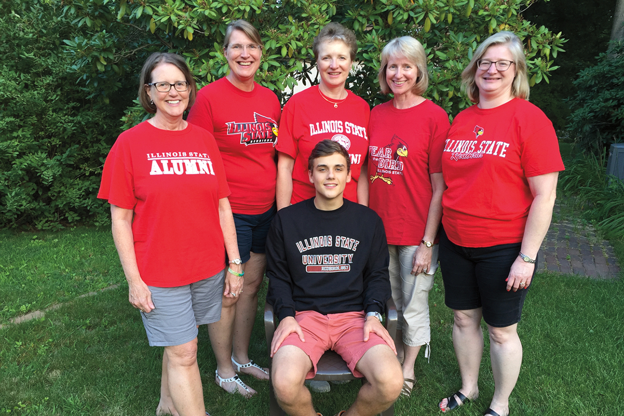 The Hynd sisters include, from left, Mary Schrock ’82, Eileen Saksa ’84, Patricia Scott ’86, Karen Fitzgerald ’88, and Janet Gibson ’91. Seated is Patricia’s son, Alex, beginning his sophomore year. Not included are Cliff Schrock ’81 and Christopher Saksa ’16.