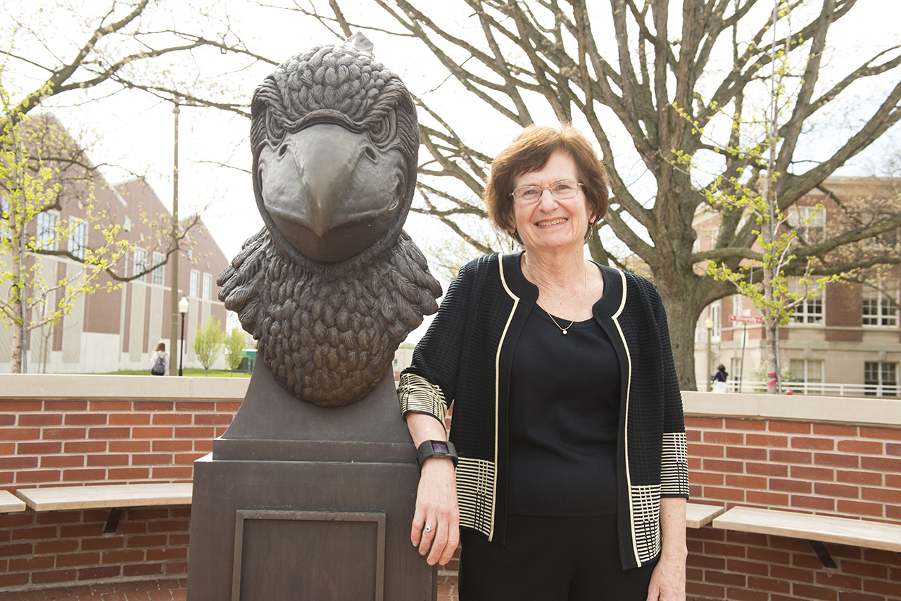 Illinois State was the perfect academic home for Distinguished Professor of Psychology Laura Berk. next to Redbird head statue