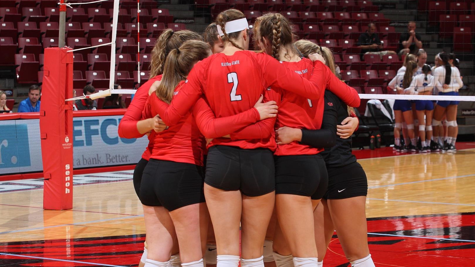 women's volleyball players huddled up ISU