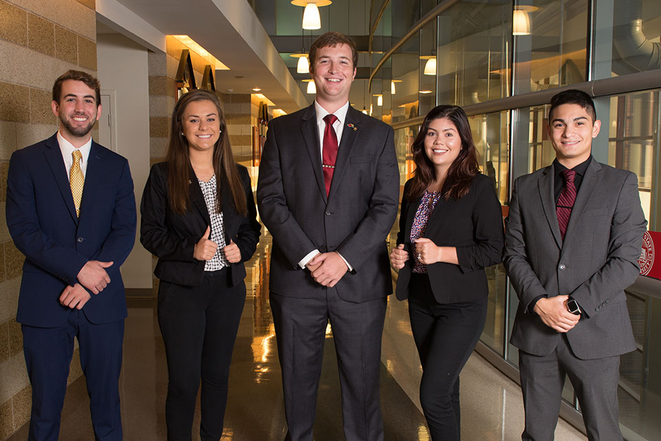 photo of several students in business suits