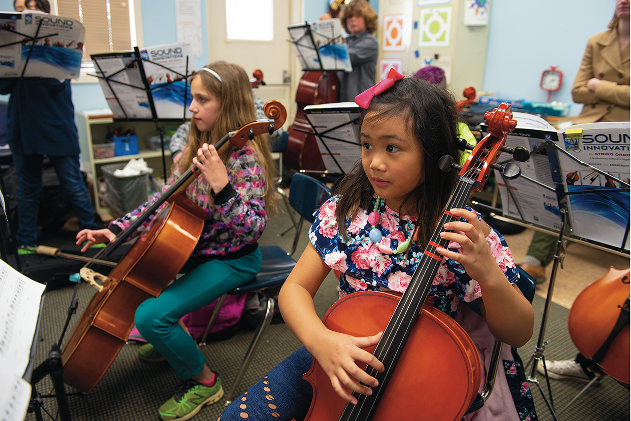 Children playing stringed instruments in ISU class at Western Avenue Community Center in Bloomington.