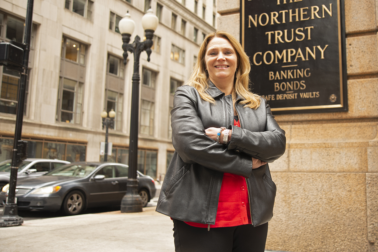 Barb O'Malley standing outside the Northern Trust Company Building