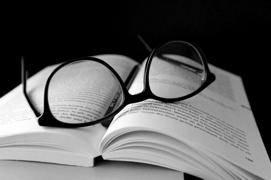 open book with glasses