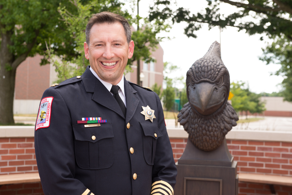 police officer next to Redbird bust