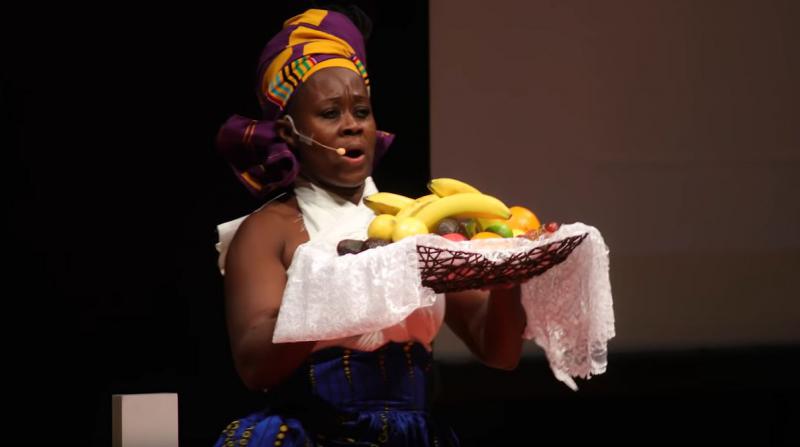 woman holding an offering of fruit