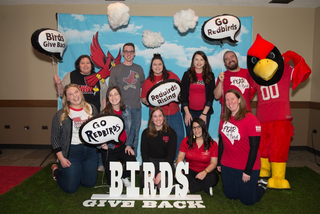 Staff and students from the Dean of Students Office taking their photo for Birds Give Back.