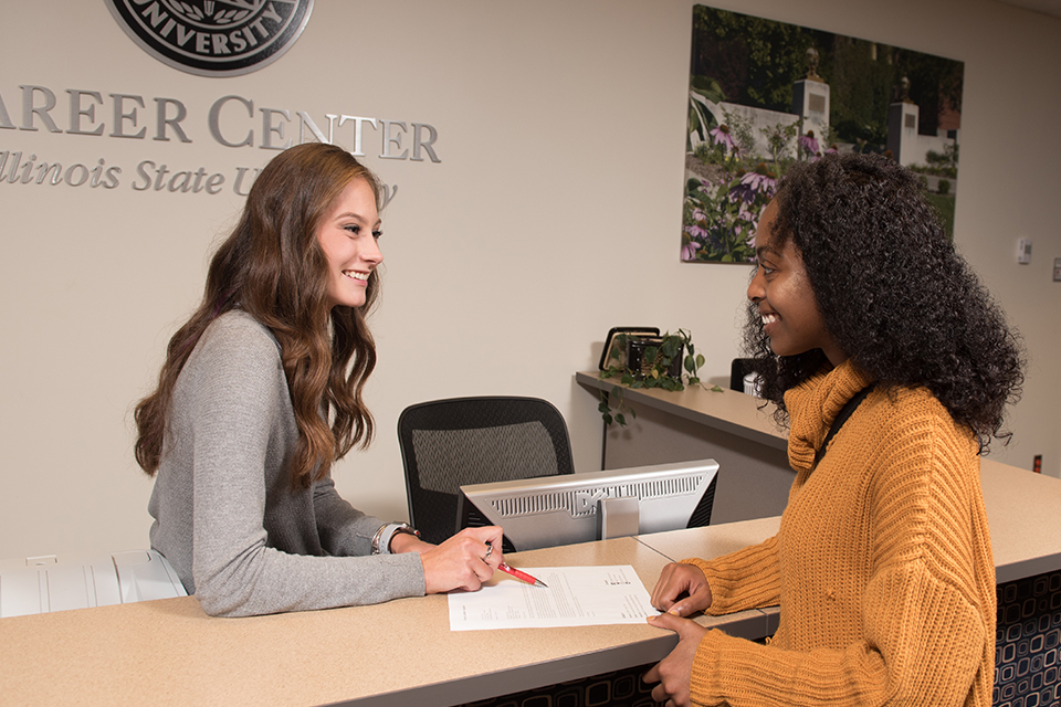 Student career ambassadors assist their peers with resume critiques during drop-in hours at the Career Center.