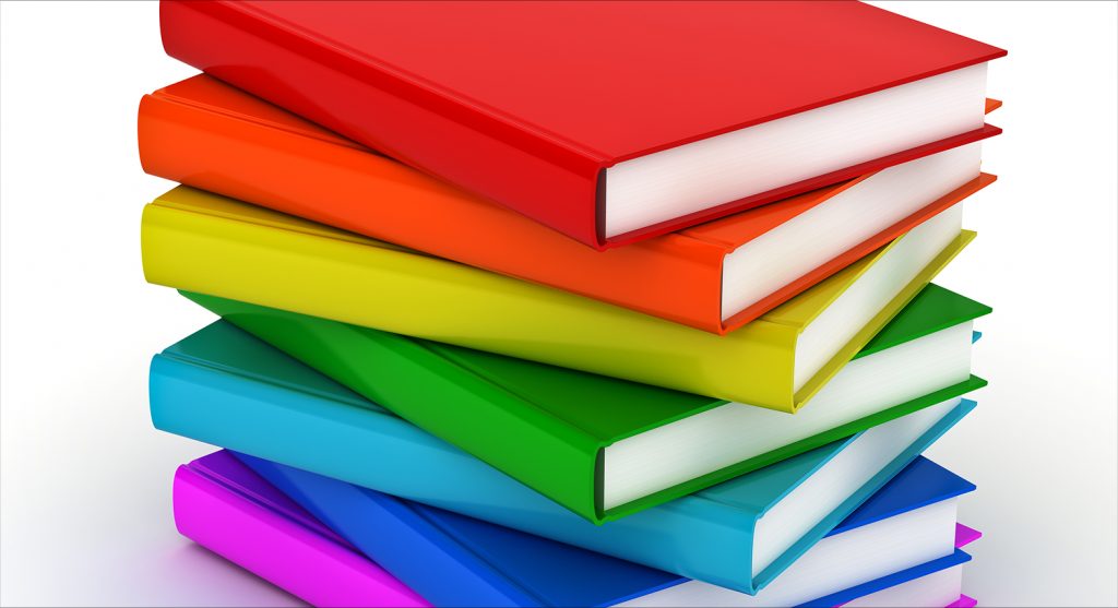 stack of books in rainbow colors