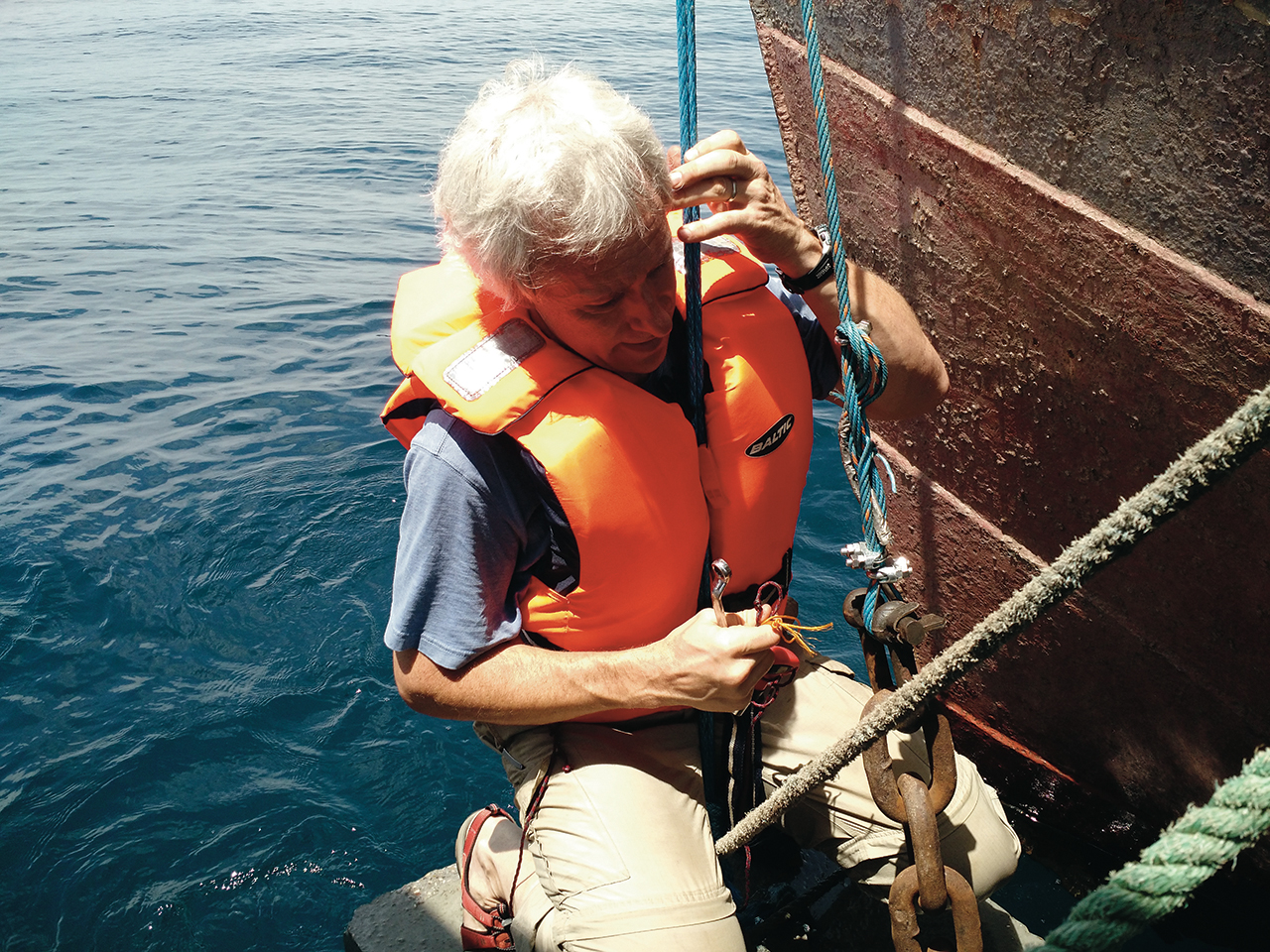 Illinois State Associate Professor of Biology William Perry gets a closer look at one of the anchors for the buoy deployment on Lake Tanganyika.