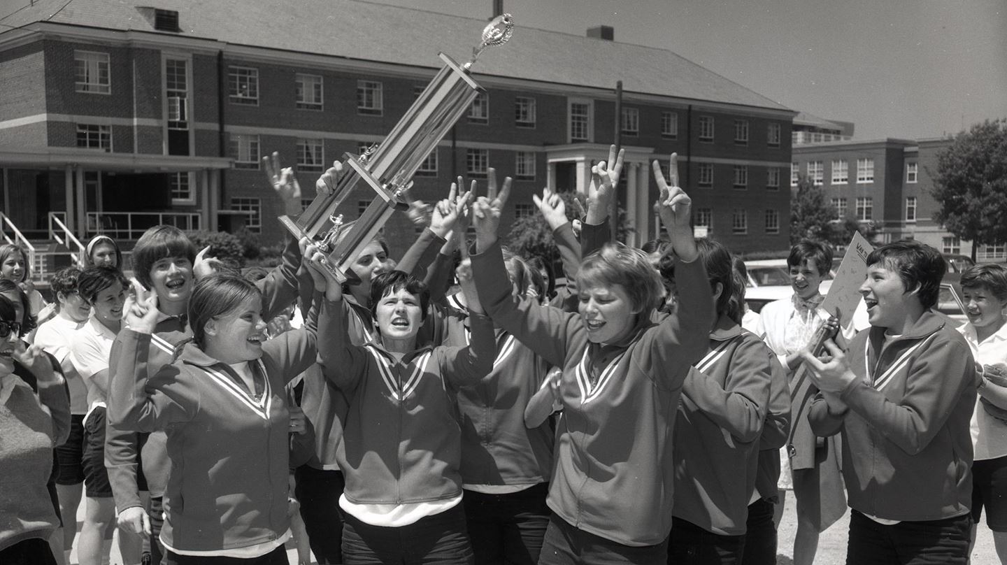 Members of the 1969 Redbird softball team celebrate their runners-up finish in the first Women's College World Series.
