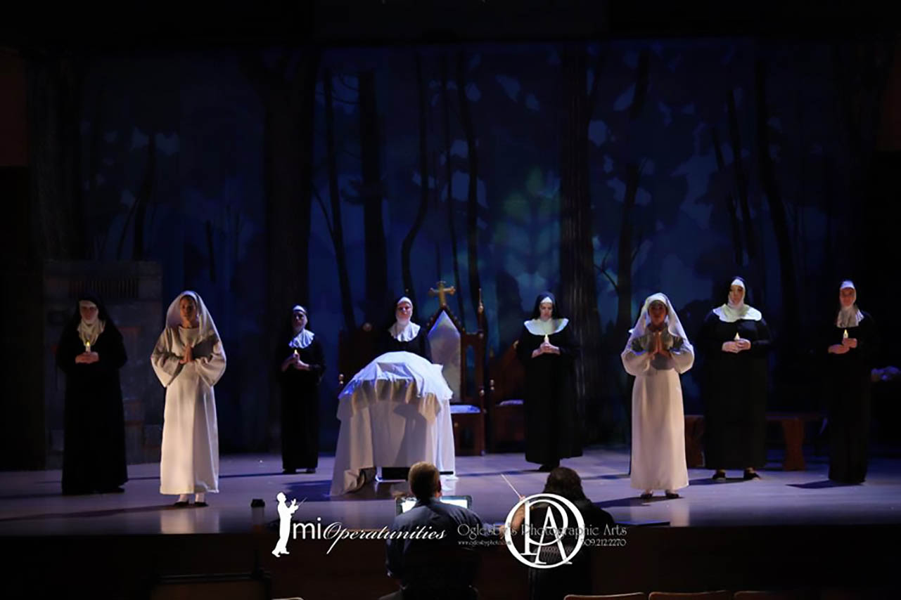 actors portraying nuns on stage