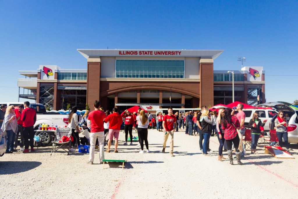 Students tailgating in the parking lot in front of Hancock Stadium