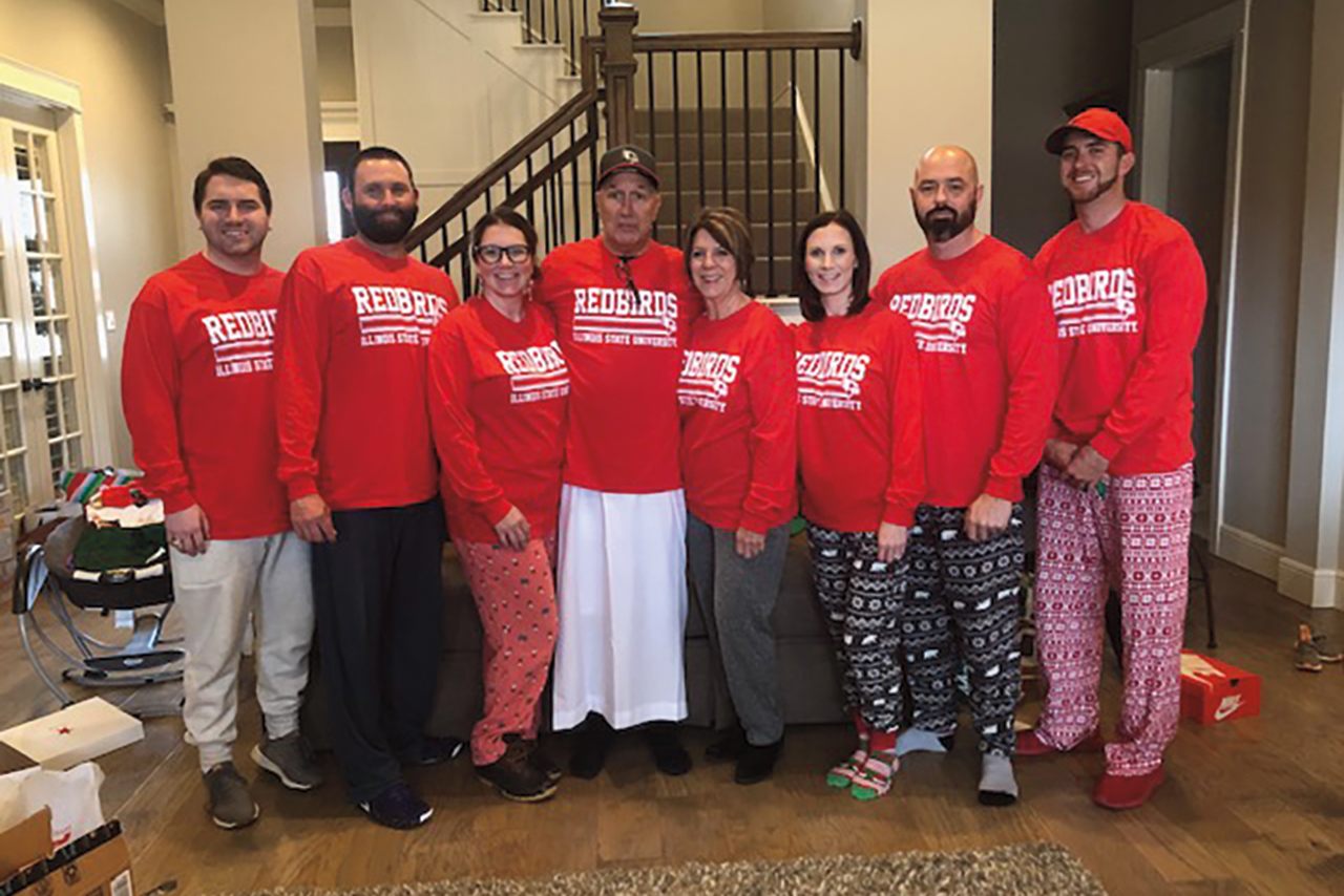 Lawrence and Missy, center, posed with their children in December 2018. From left are son Chase, and daughter Marissa Bevan with her husband, Austin. From right of Missy are daughter Jackie Hopper with her husband, Justin; and son, Ross. Lawrence is wearing traditional Dubai apparel.