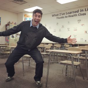 Scott Todnem posing in his classroom