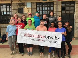 Group picture with Alternative Breaks banner