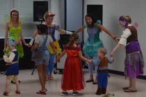 ISU students in Disney costumes dance with young children