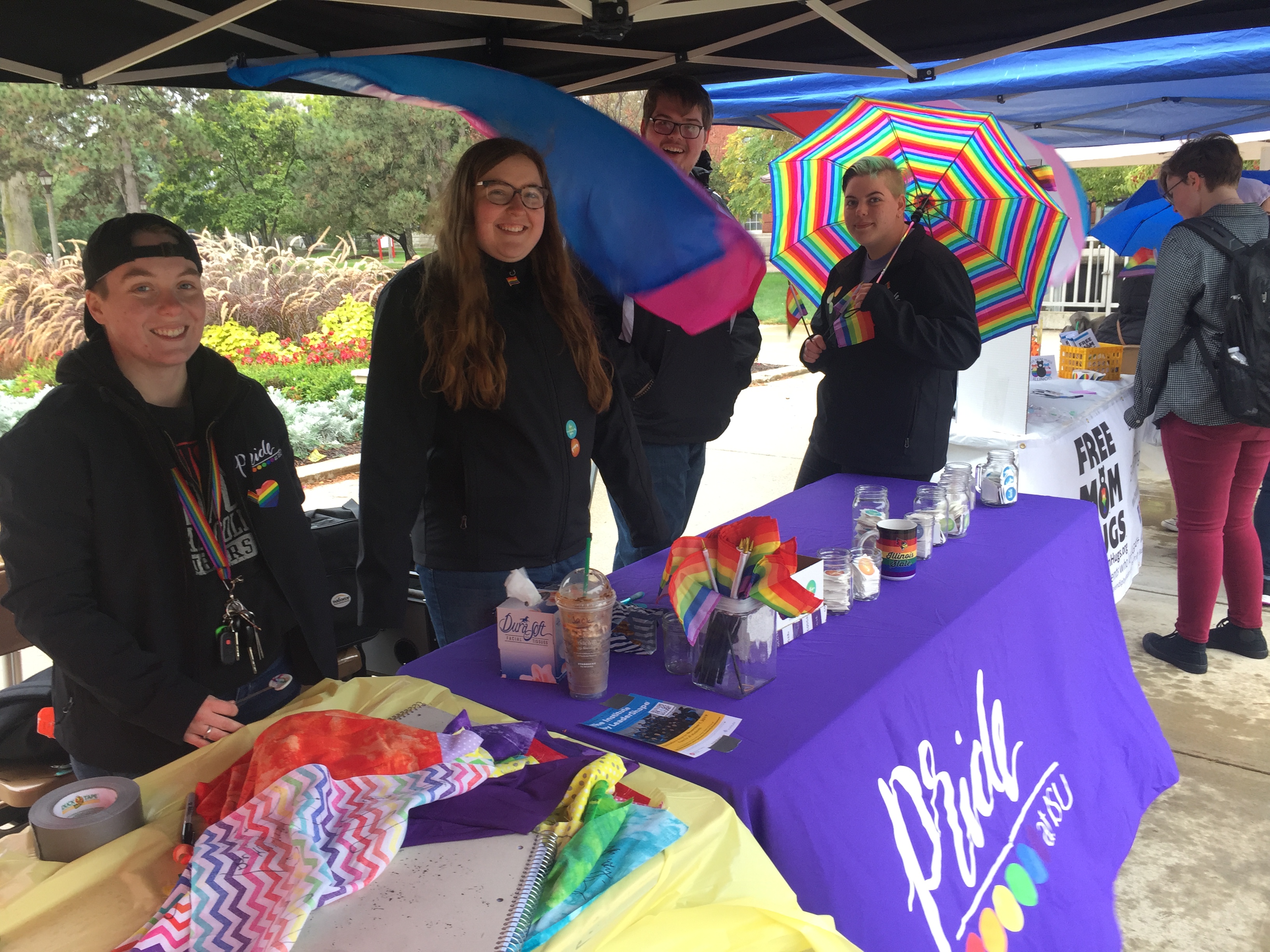 ISU Pride President Emily Patterson (second from left) and fellow Pride members tabled last Friday on the Quad to offer information and words of encouragement to students on National Coming Out Day.