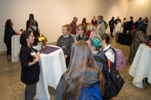 Students and alumni conversing at the second annual CreativeCon