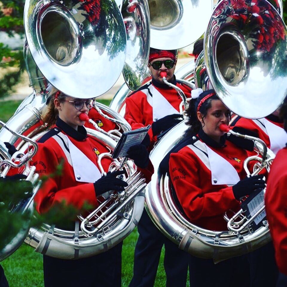 Big Red Marching Machine tuba players performing.