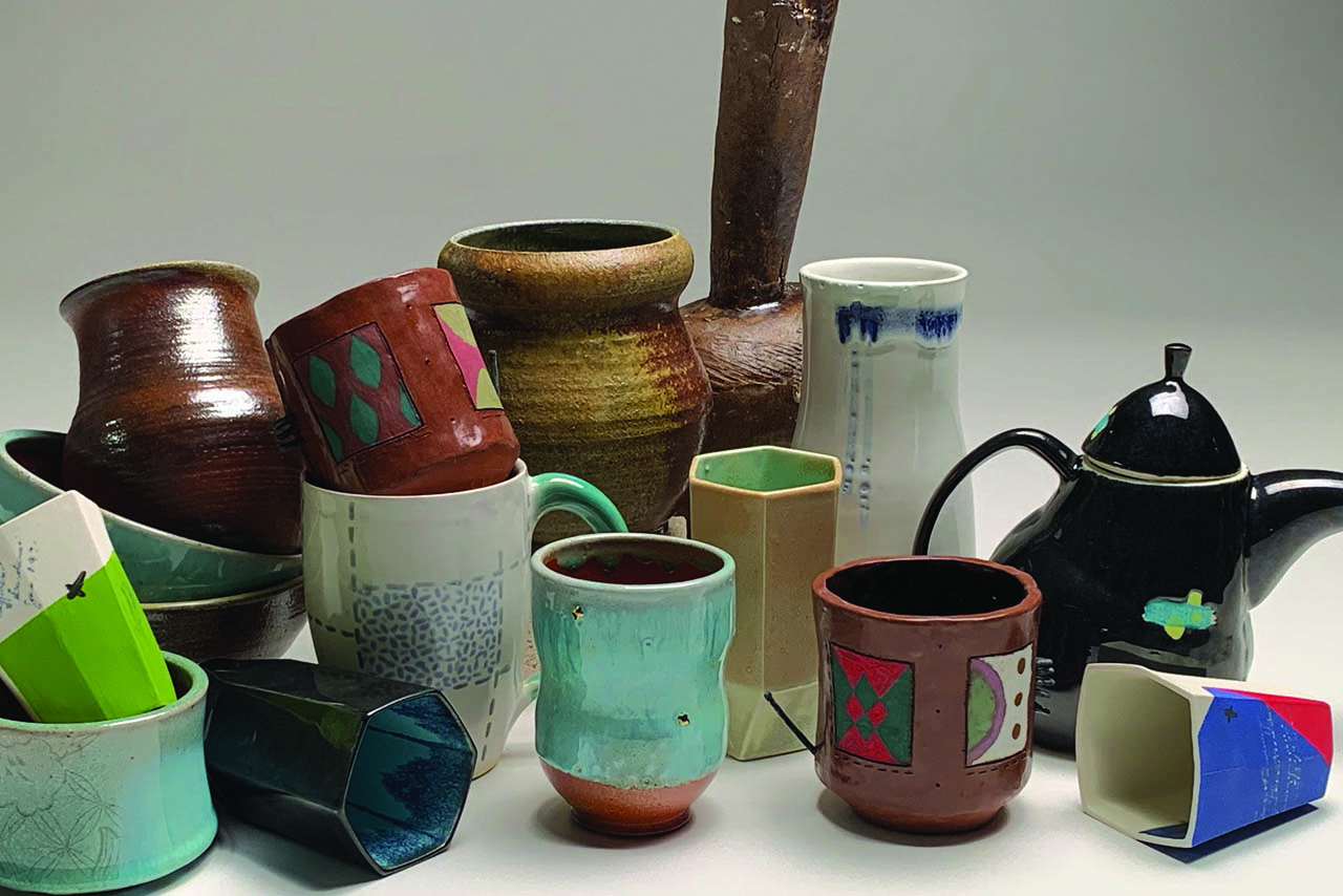 Photo of a variety of ceramic artwork including cups, mugs, vases, teapots, and others