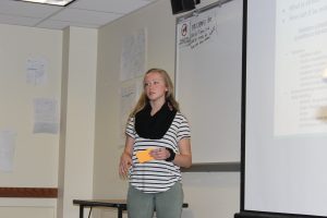 Exercise science major Maggie Burris presents on her group's project for the YWCA Labyrinth.