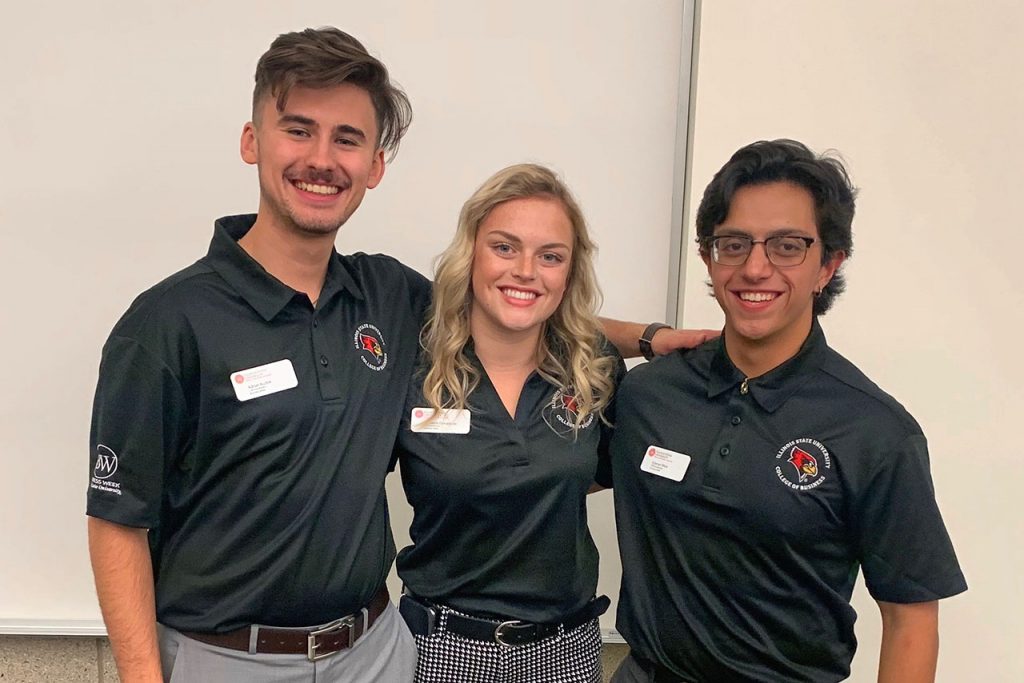 Student leaders Adrian Kuzbik, Shannon Donaldson, and Estevan Mora at the Corporate Social Responsibility Case Competition